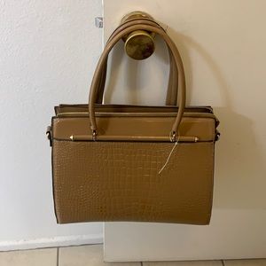 Ladies Tan, patent leather purse.